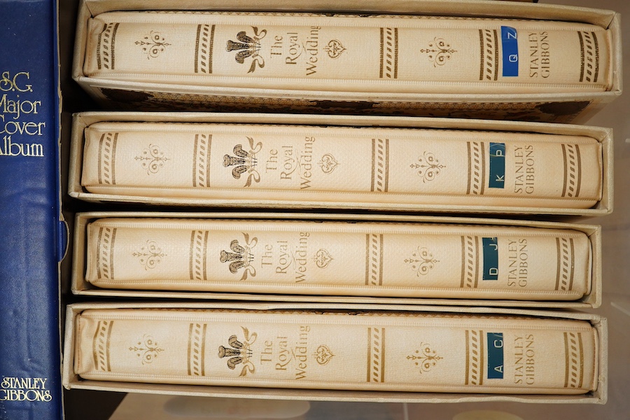 A box containing eight modern stamp albums